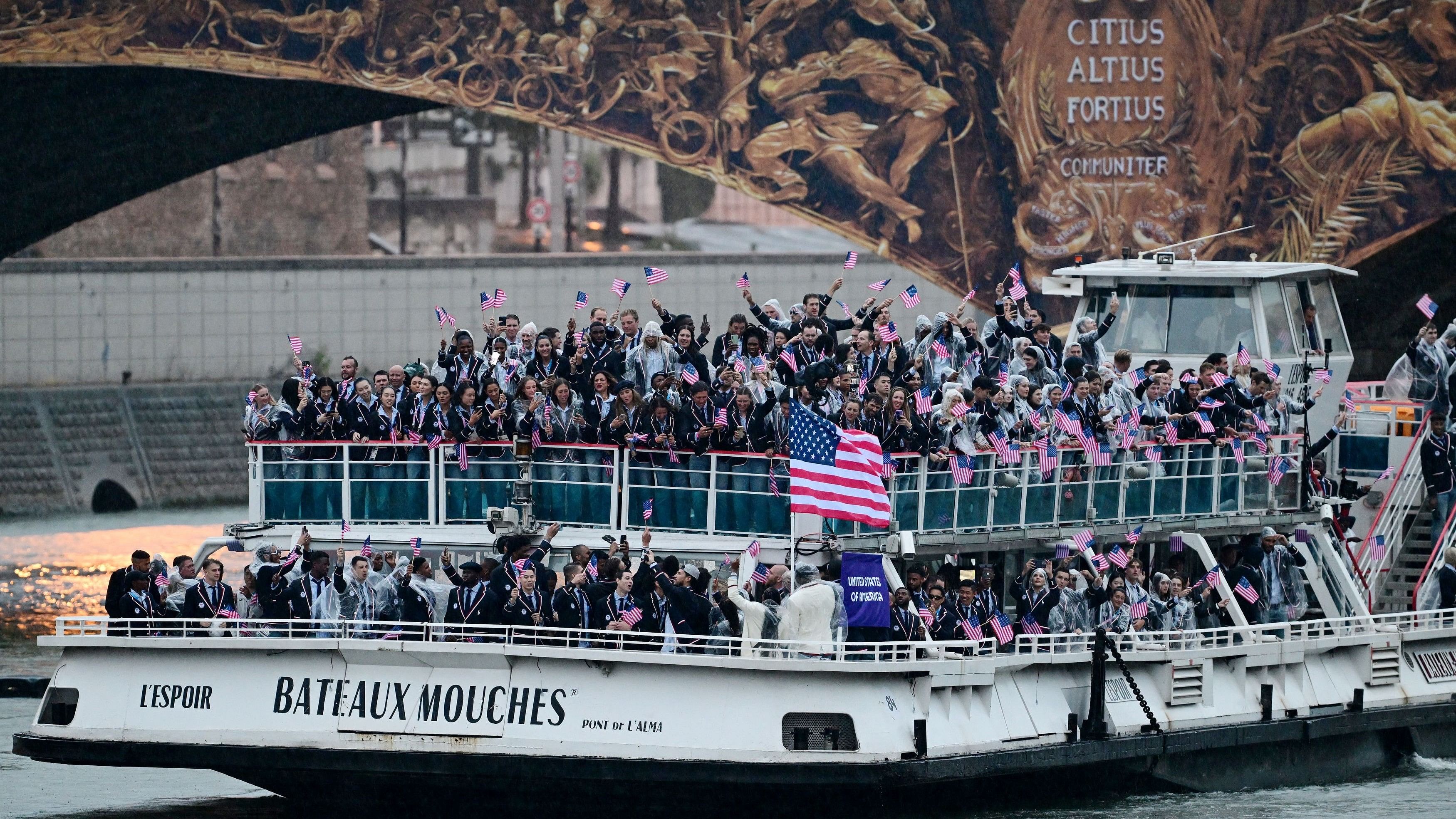 <div class="paragraphs"><p>Athletes of United States are seen on their boat at Pont d'Austrerlitz in the river Seine during the opening ceremony.</p></div>